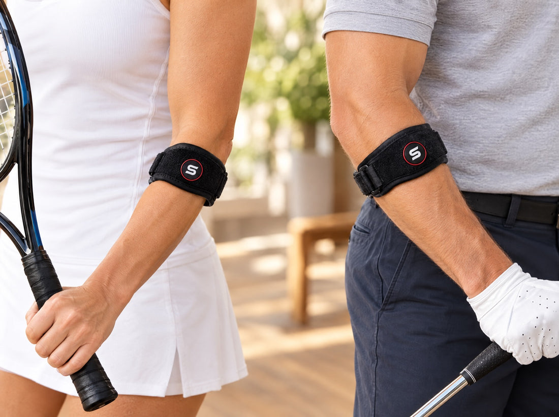 Two forearms side by side on a light oak table, wearing the Sleeve Stars Elbow Brace