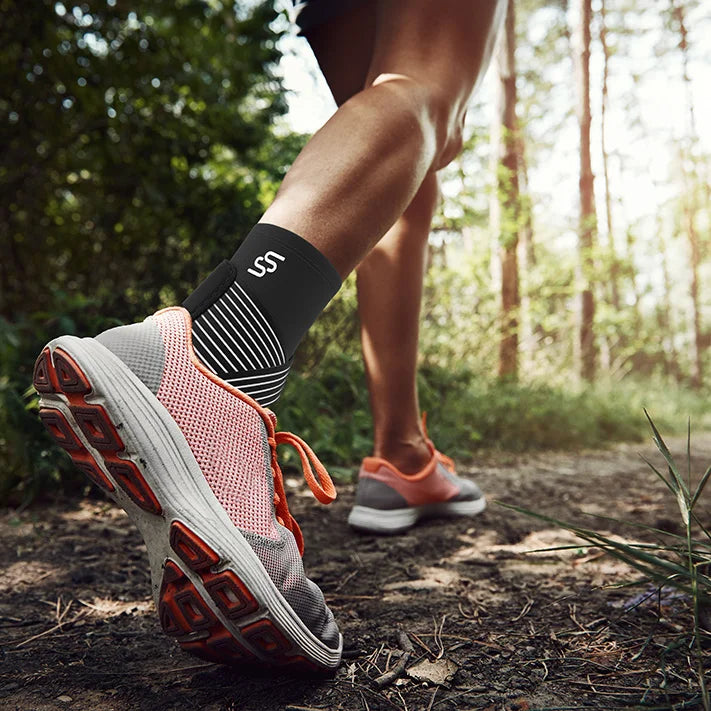 Adjustable ankle brace with secure straps providing support and stability for injury recovery and prevention.